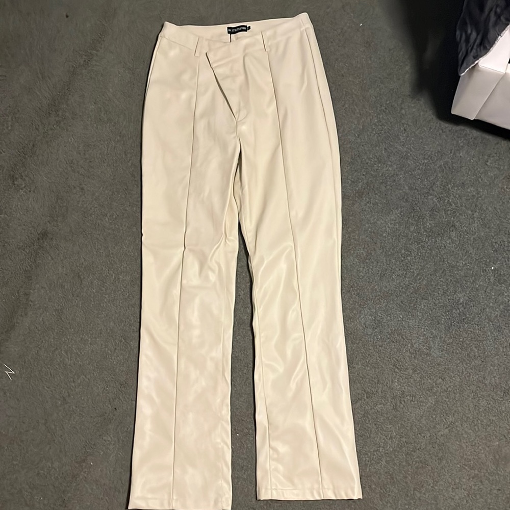 Cream leather asymmetrical pants